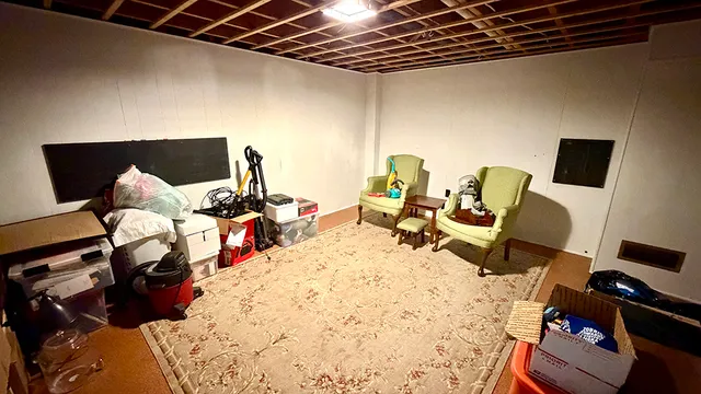 a bed room with a bed and a chair