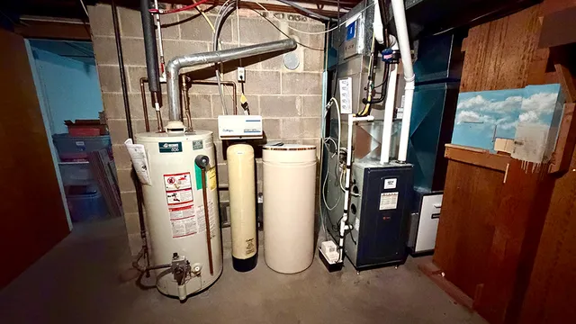 a view of walk in closet with clothes