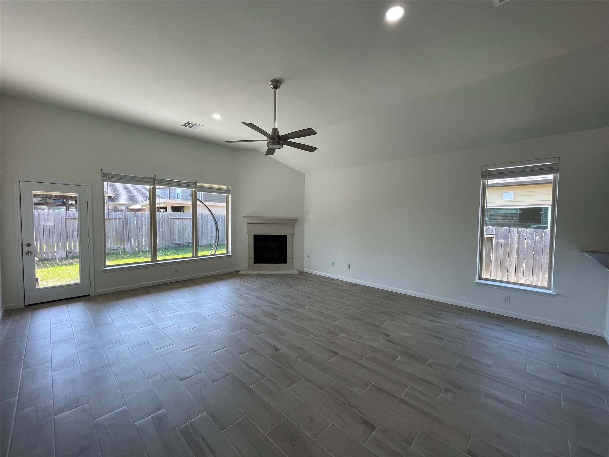 4118 Guild Meadows Drive Houston, TX 77084 - Photo 21 of 35 a view of empty room with wooden floor and fan