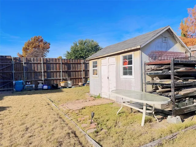 a view of a house with pool and sitting area