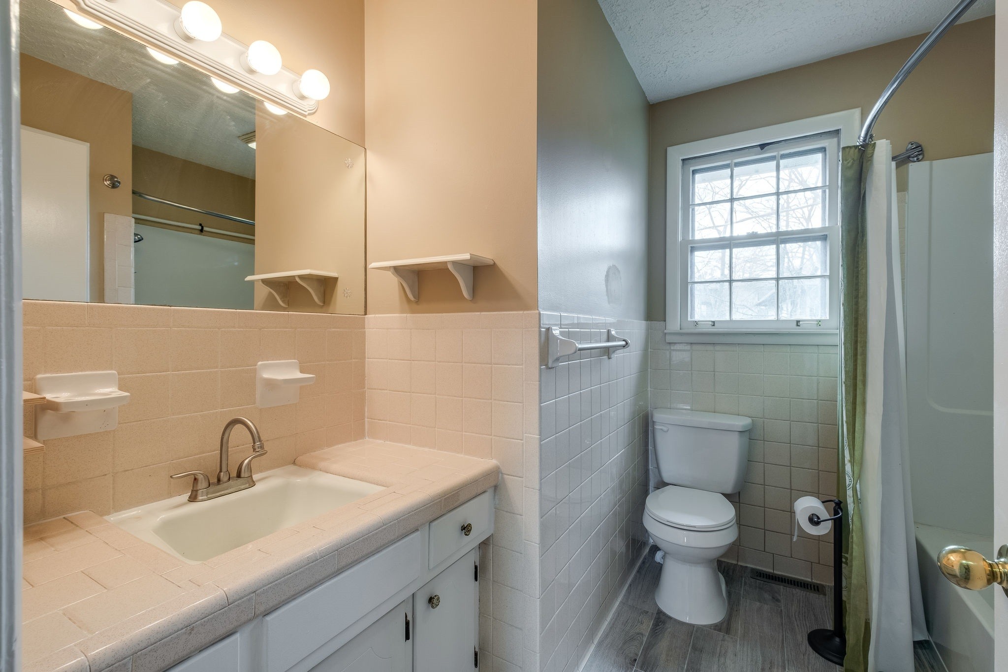 6712 Upton Lane Nashville, TN 37209 - Photo 12 of 18 a bathroom with a sink toilet and shower
