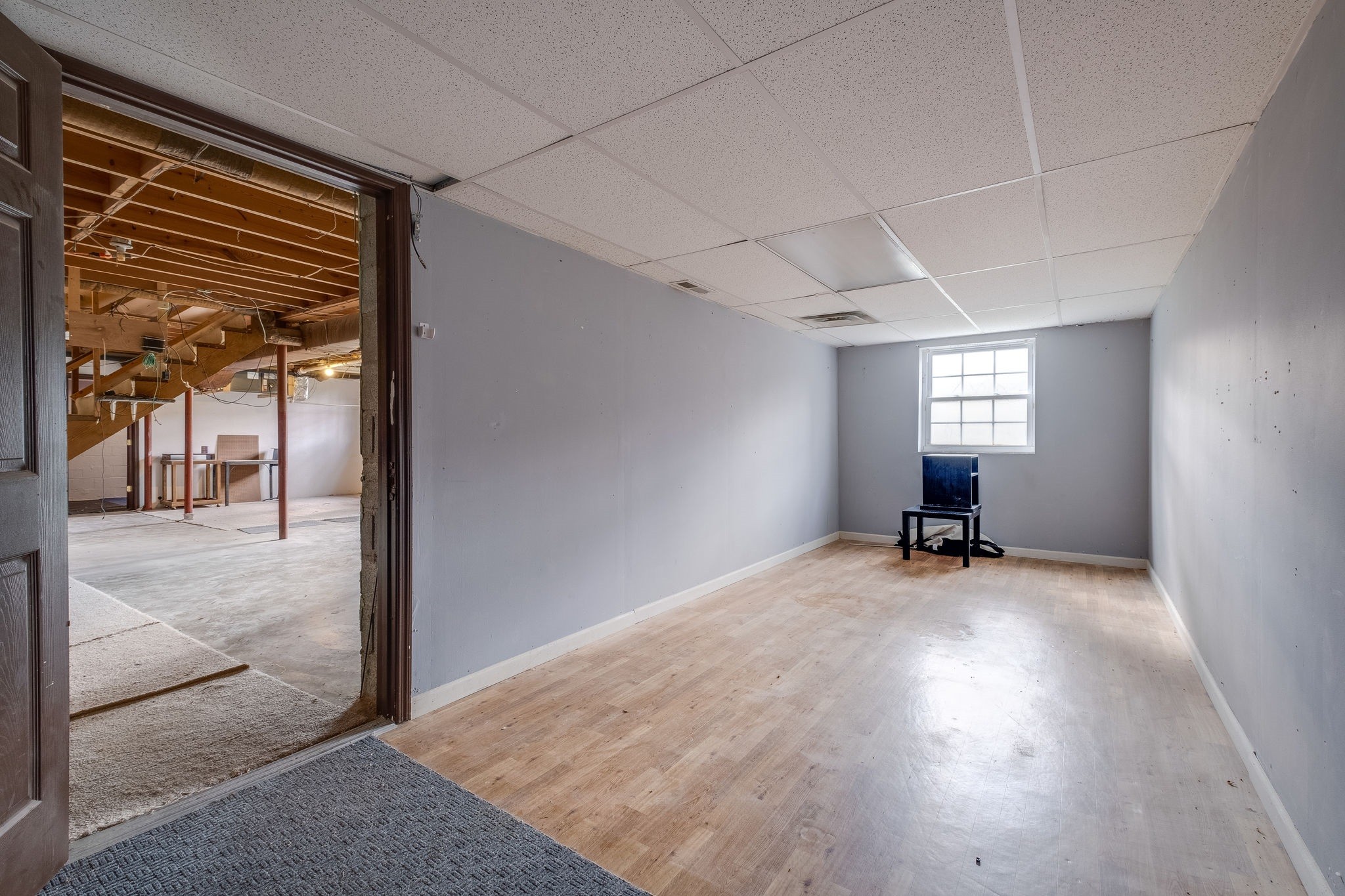 6712 Upton Lane Nashville, TN 37209 - Photo 16 of 18 an empty room with windows and wooden floor