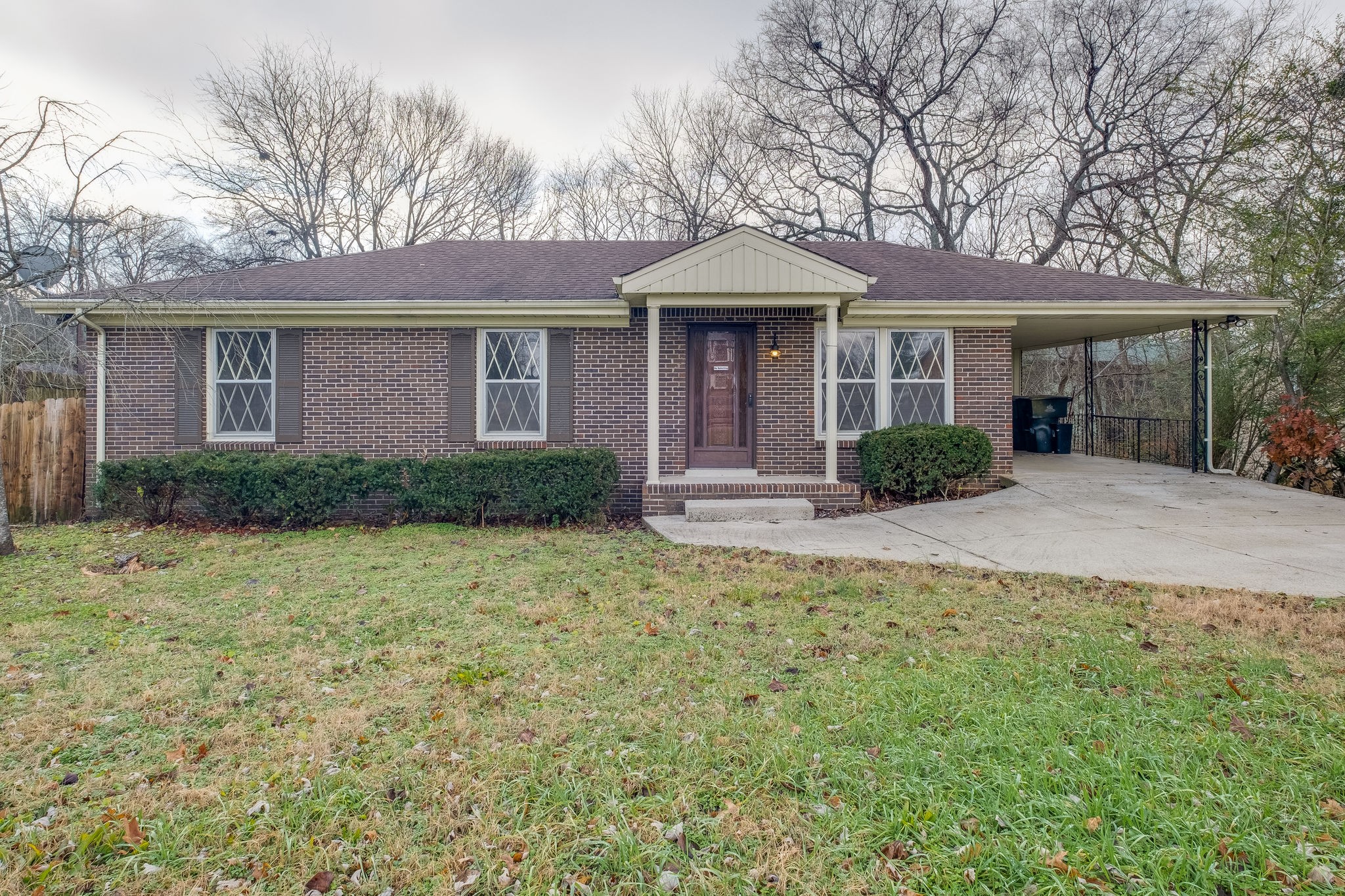 6712 Upton Lane Nashville, TN 37209 - Photo 2 of 18 a front view of a house with garden