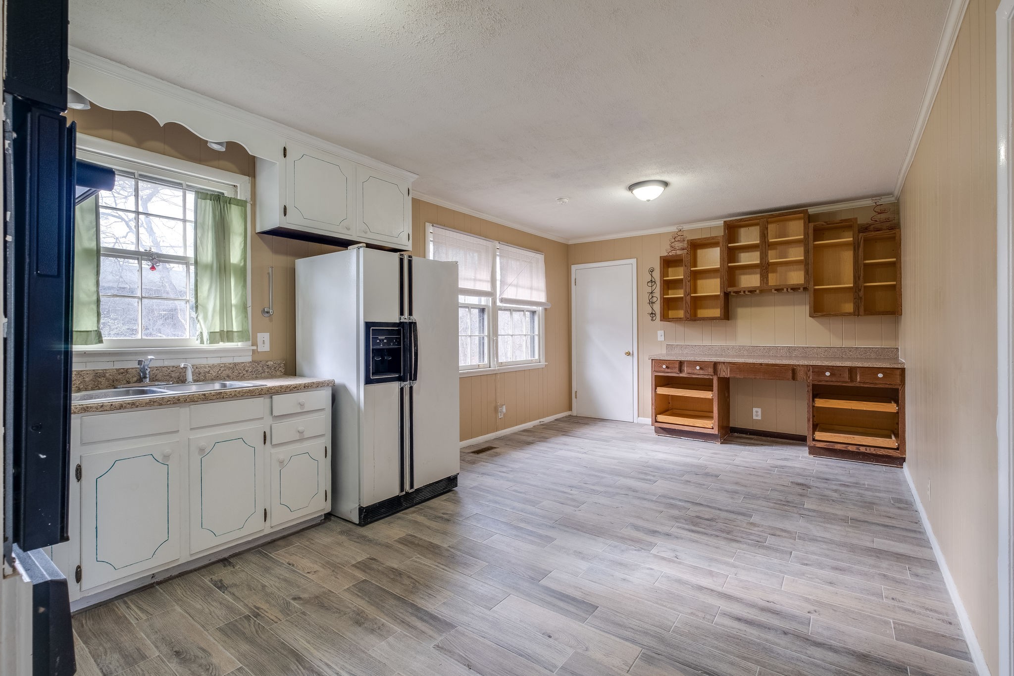 6712 Upton Lane Nashville, TN 37209 - Photo 5 of 18 a kitchen with stainless steel appliances a stove top oven and sink