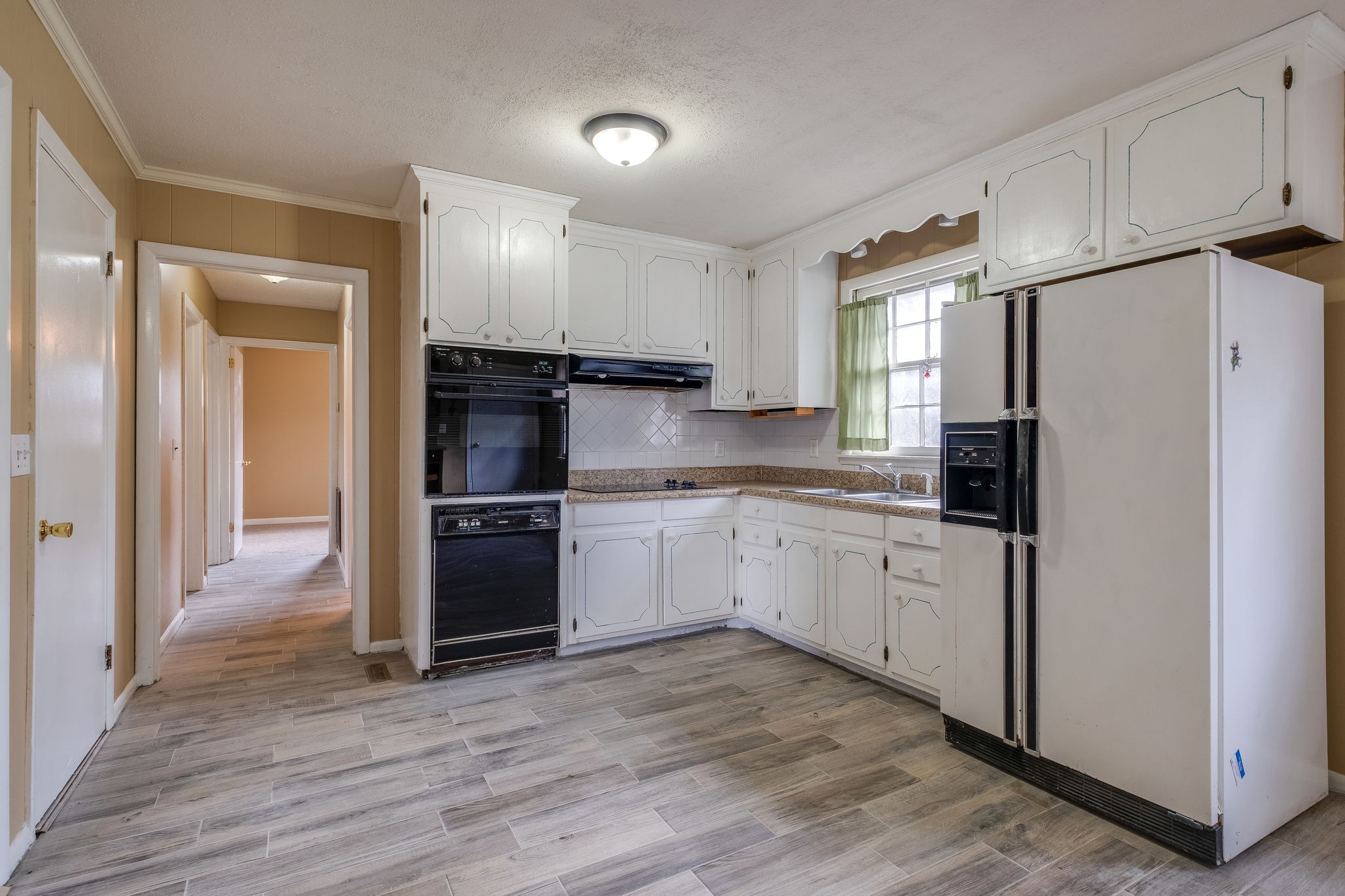 6712 Upton Lane Nashville, TN 37209 - Photo 6 of 18 a kitchen with a refrigerator and a sink
