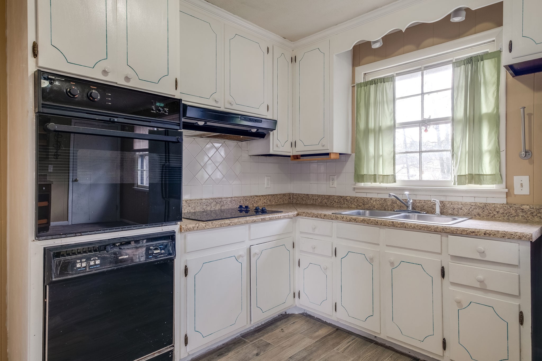6712 Upton Lane Nashville, TN 37209 - Photo 7 of 18 a kitchen with stainless steel appliances granite countertop a stove and a microwave
