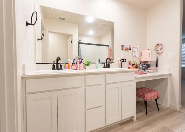 a bathroom with a sink and a mirror