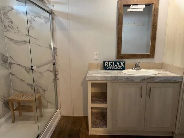 a bathroom with a sink and a mirror