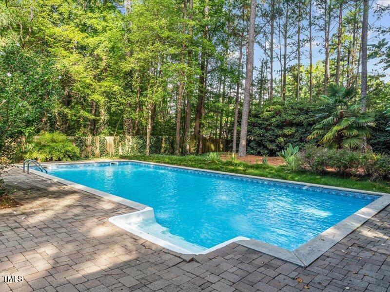 7733 Cart Track Trail Raleigh, NC 27615 - Photo 5 of 31 a view of a swimming pool with a yard