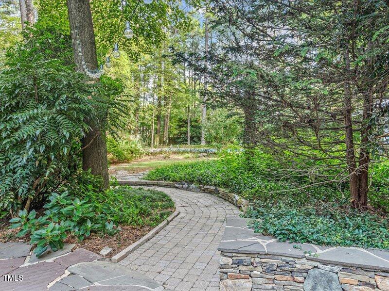 7733 Cart Track Trail Raleigh, NC 27615 - Photo 7 of 31 a view of a garden with pathway