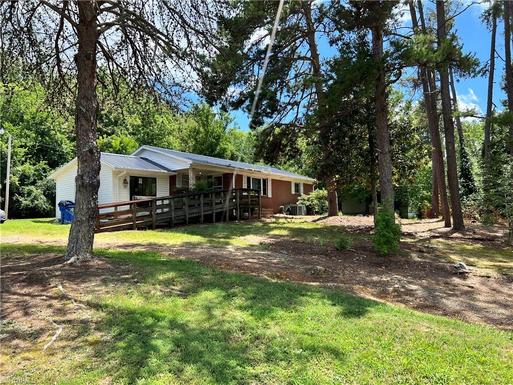 1429 Feezor Road Lexington, NC 27292 - Photo 2 of 12 Side view. Handicap ramp can be moved. Brick steps are under the decking.