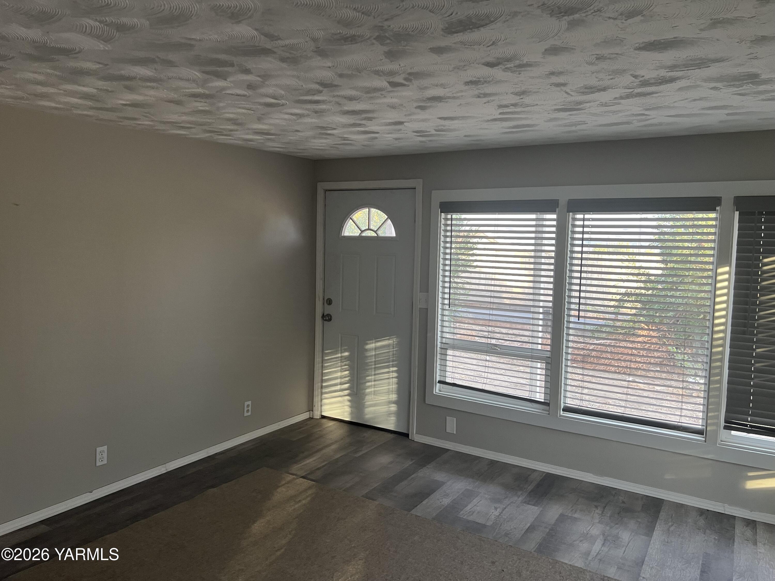 54704 North Evert Road Benton City, WA 99320 - Photo 11 of 21 a view of an empty room with a window