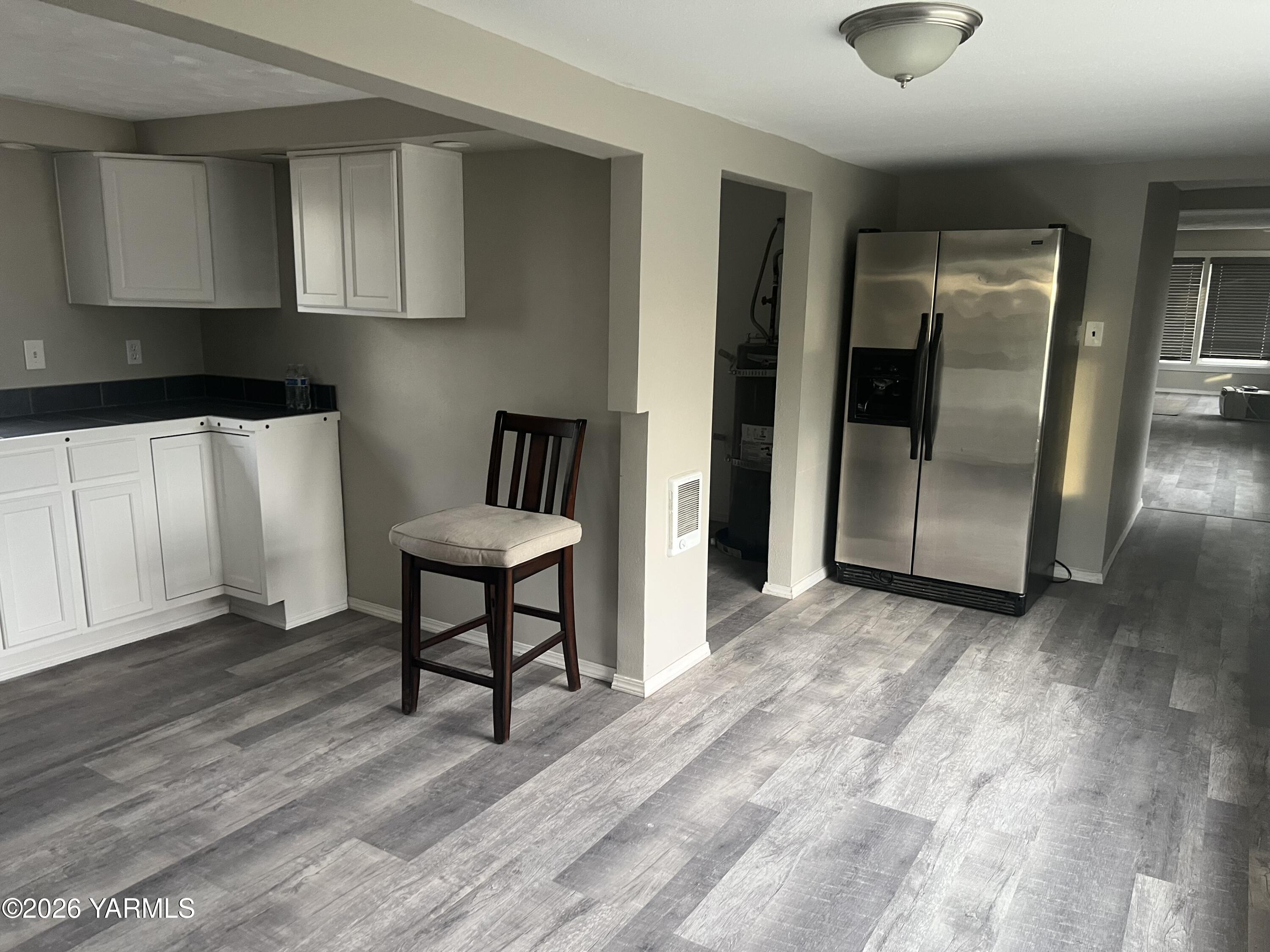 54704 North Evert Road Benton City, WA 99320 - Photo 6 of 21 a view of a kitchen with furniture and wooden floor