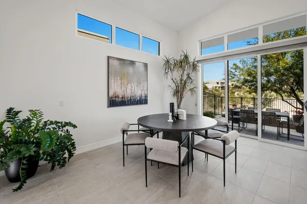 a view of a livingroom with furniture and a potted plant