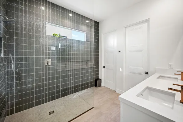 a bathroom with a sink and a shower