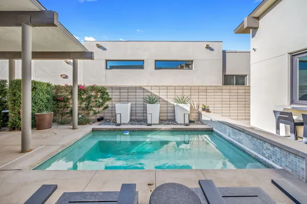 a house view with a sitting space and garden view