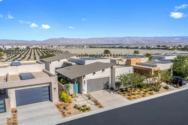 an aerial view of a house with a garden space