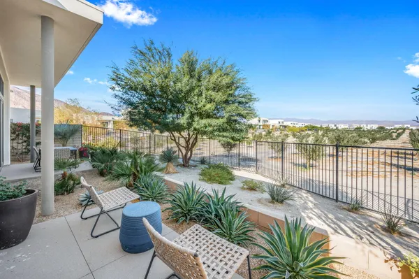 a view of a balcony with lake view and a potted plant
