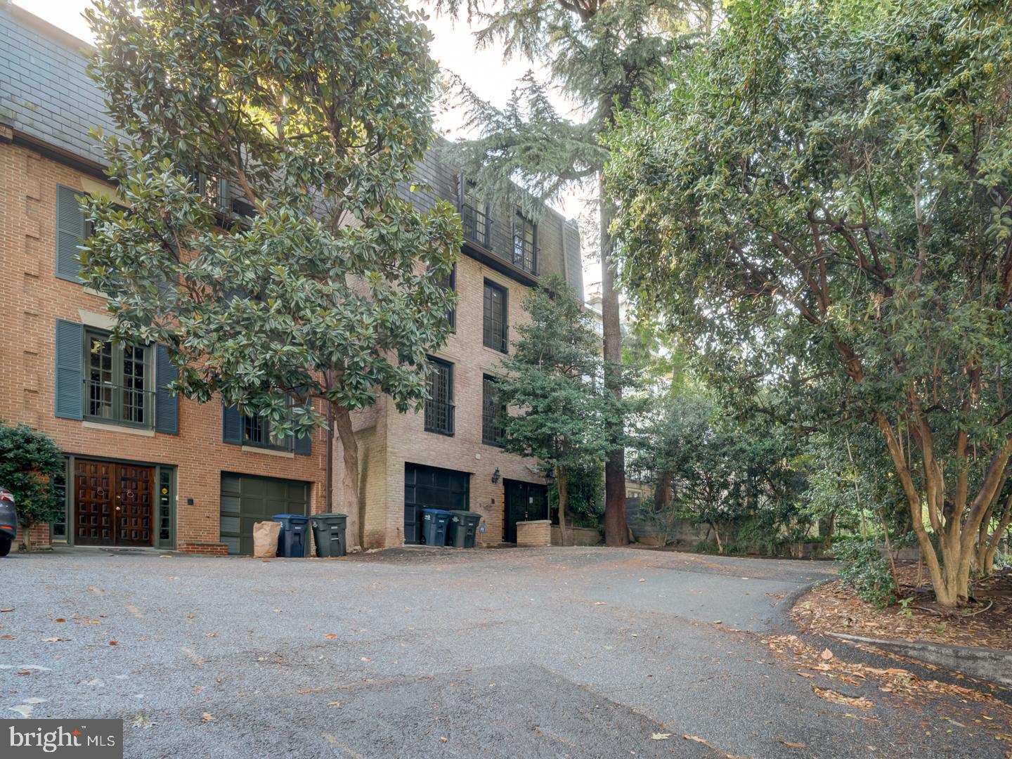 2142 Cathedral Avenue Northwest Washington, DC 20008 - Photo 1 of 60 a front view of a house with a yard and garage