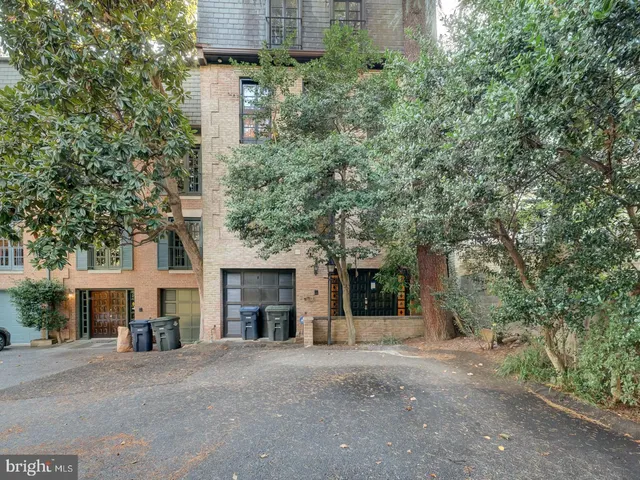 front view of a house with a yard and a street