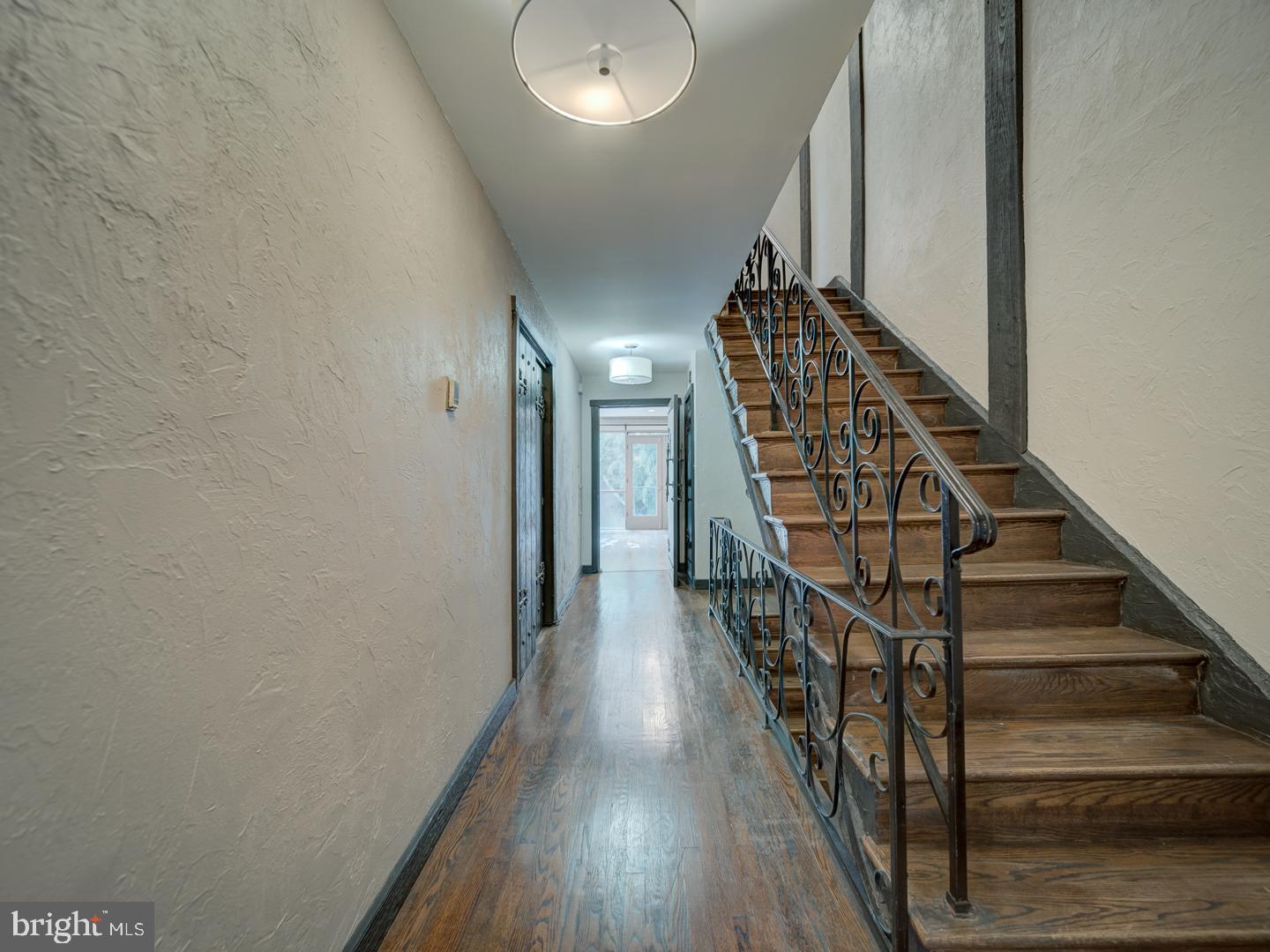 2142 Cathedral Avenue Northwest Washington, DC 20008 - Photo 42 of 60 a view of staircase with wooden floor and white walls