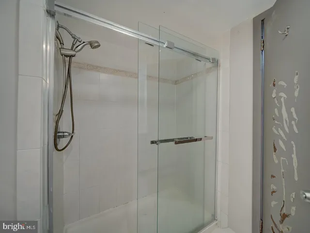 a bathroom with a sink a tub and a mirror