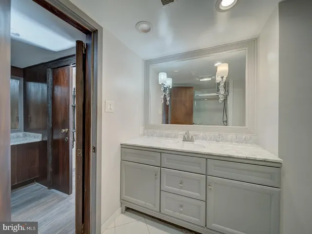 a bathroom with a glass shower door