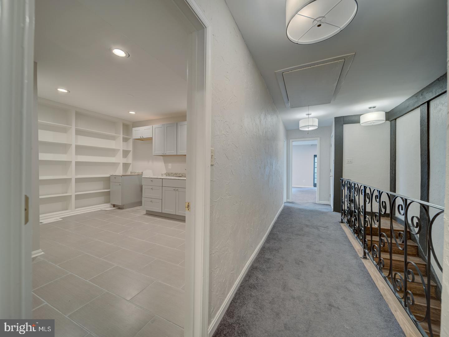 2142 Cathedral Avenue Northwest Washington, DC 20008 - Photo 55 of 60 a view of a hallway with wooden shelves