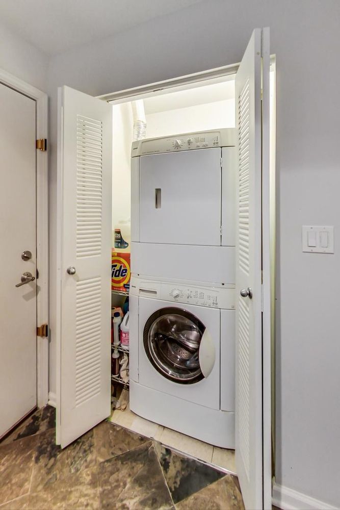 Undisclosed Address Chicago, IL 60610 - Photo 4 of 23 a utility room with dryer and washer