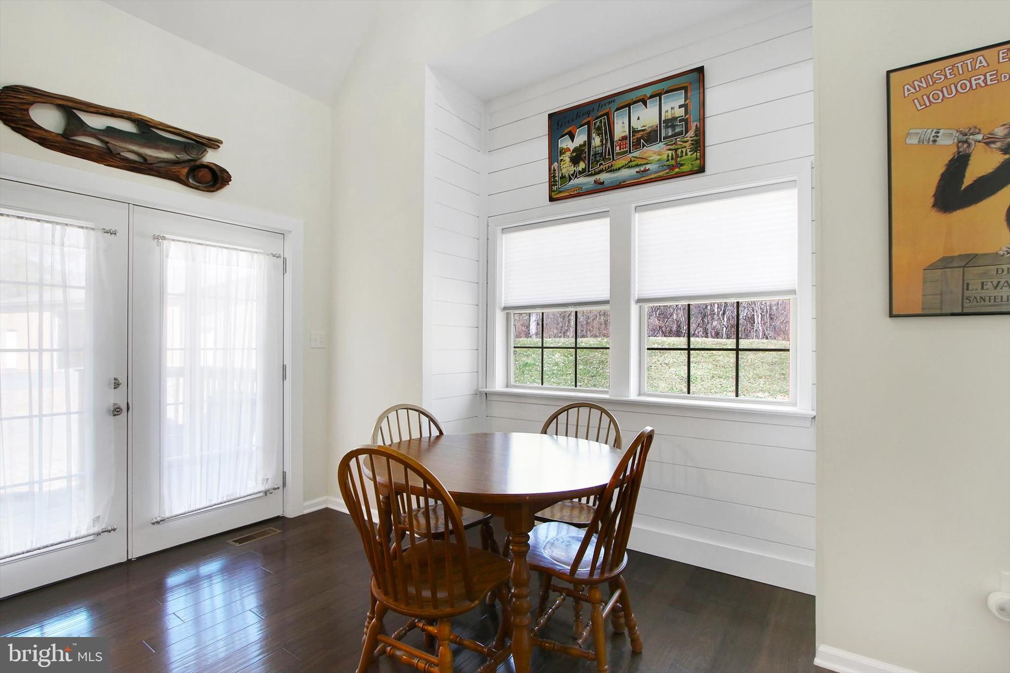 971 McGlaughlin Road Fairfield, PA 17320 - Photo 13 of 57 a view of a dining room with furniture window and wooden floor