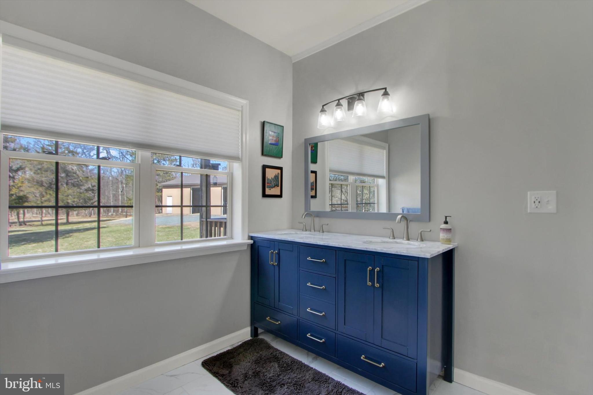 971 McGlaughlin Road Fairfield, PA 17320 - Photo 21 of 57 a bathroom with a sink and a mirror