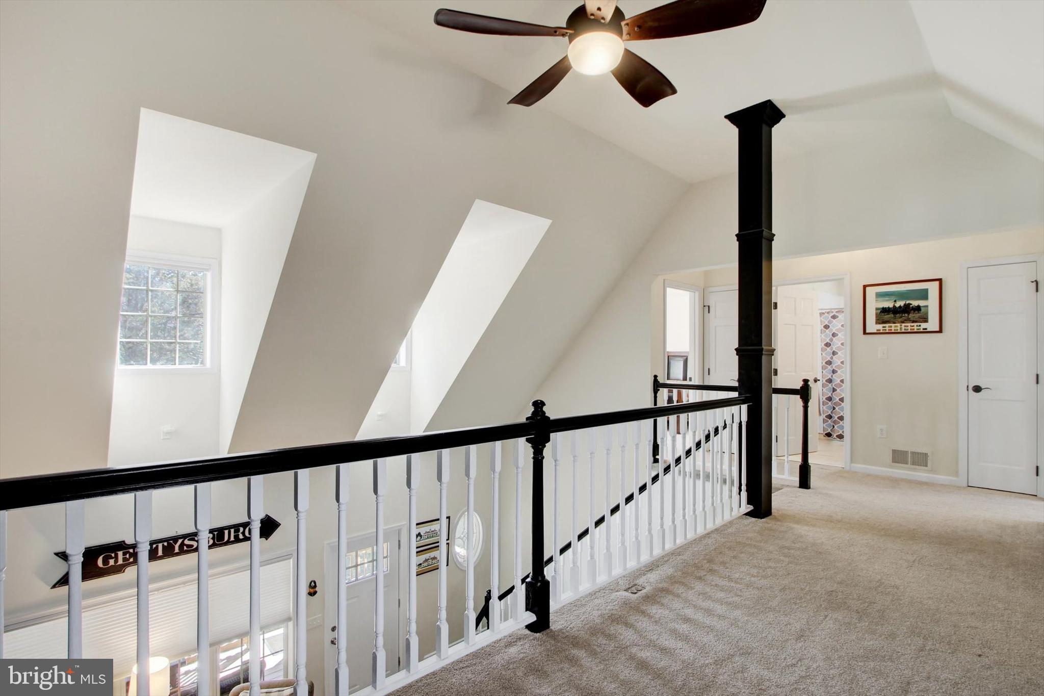 971 McGlaughlin Road Fairfield, PA 17320 - Photo 23 of 57 a view of staircase with lots of frames on wall and a window