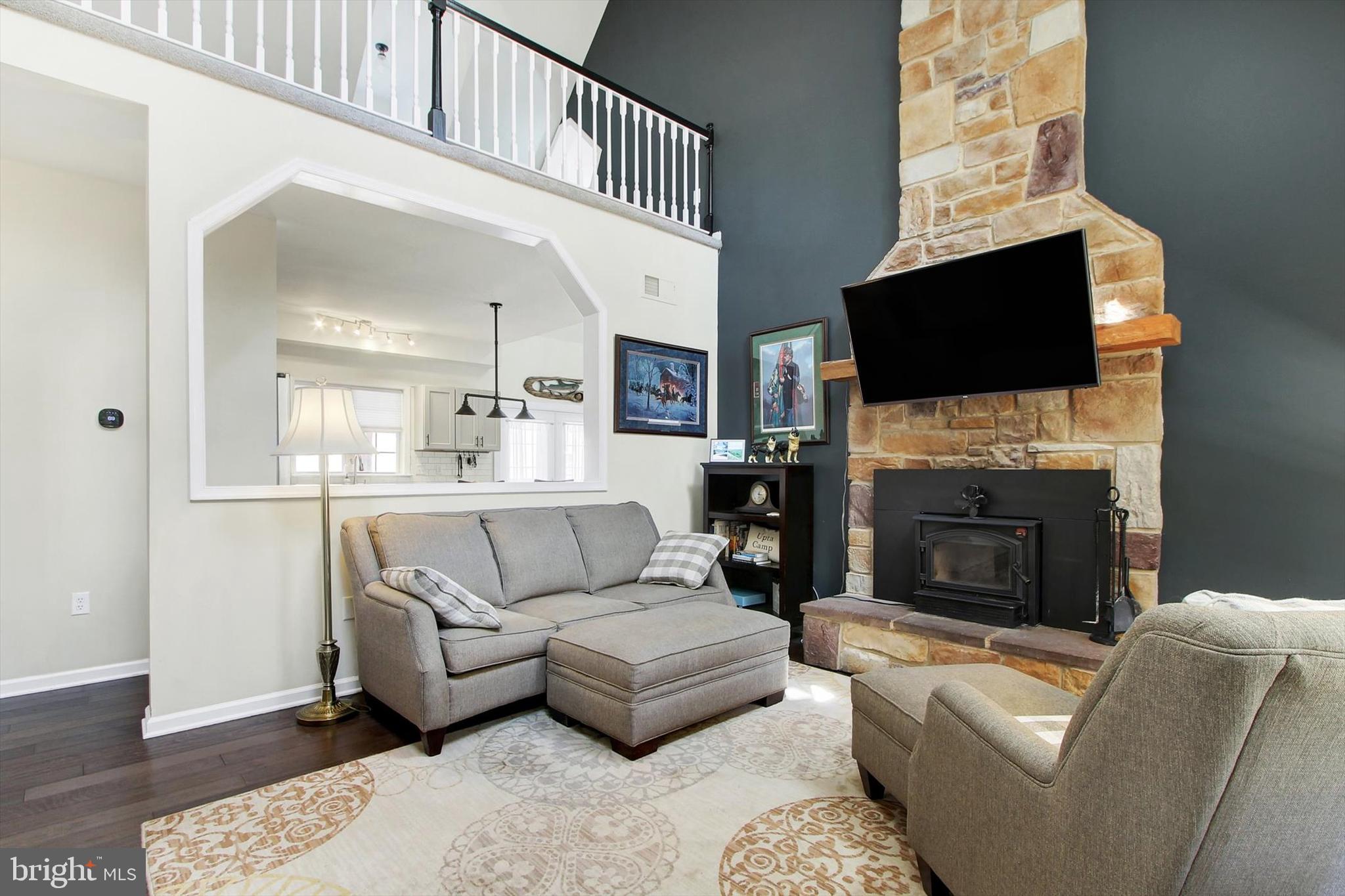 971 McGlaughlin Road Fairfield, PA 17320 - Photo 5 of 57 a living room with furniture a flat screen tv and a fireplace
