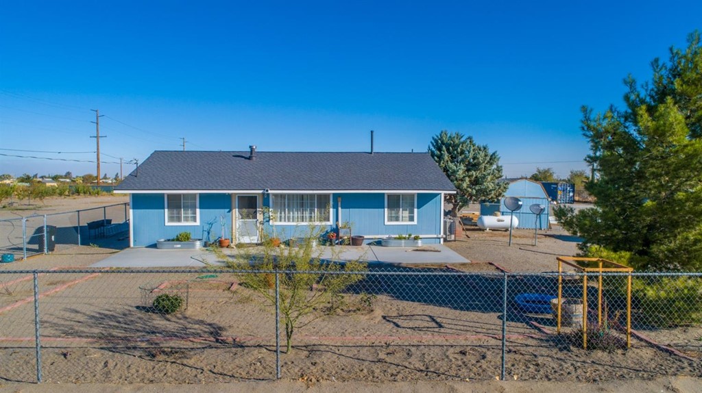 4938 Chevoit Road Phelan, CA 92371 - Photo 1 of 1 a front view of a house with garden