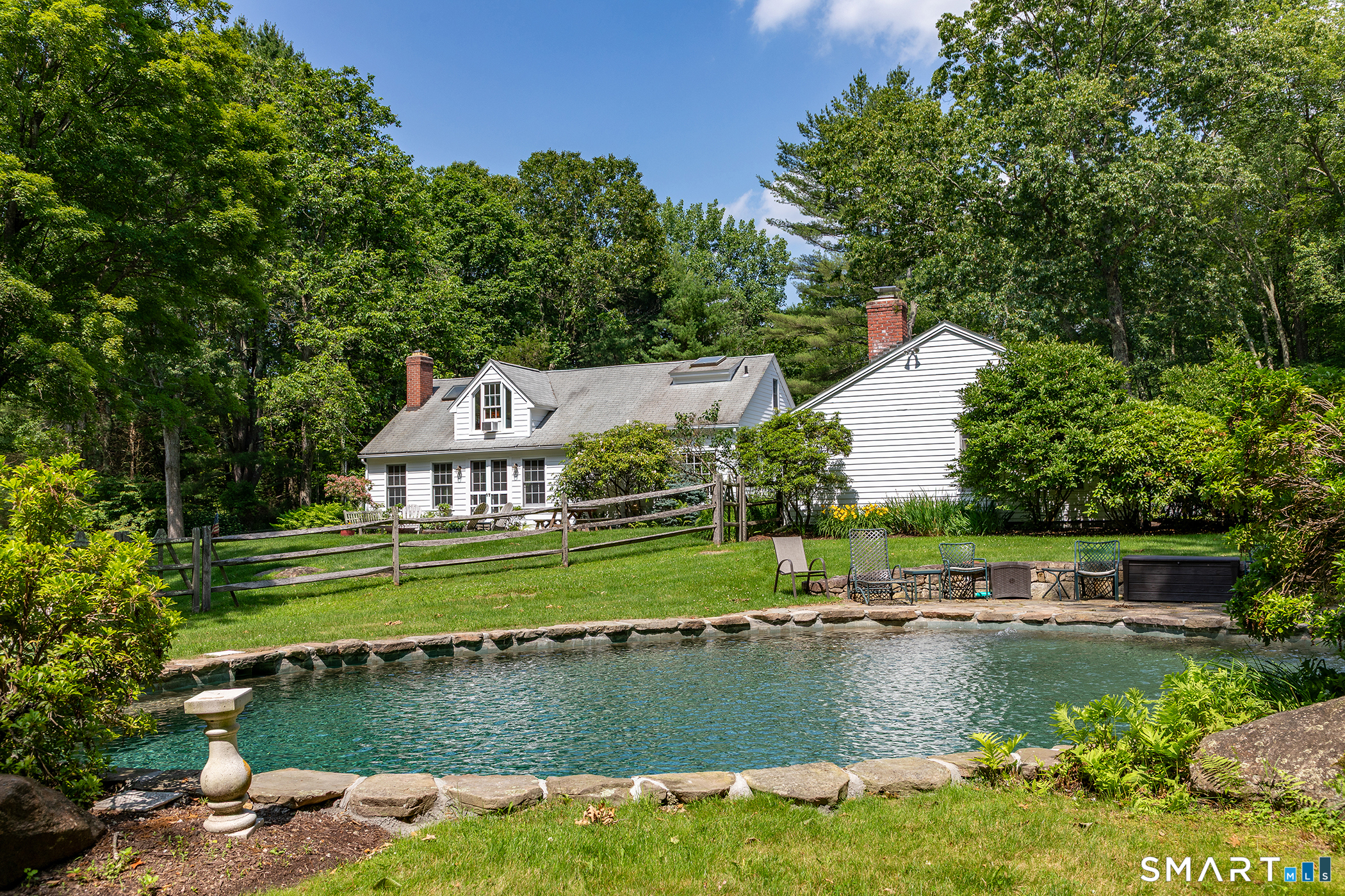 40 Camps Flat Road Kent, CT 06785 - Photo 1 of 5 a view of a house with a yard and a pond