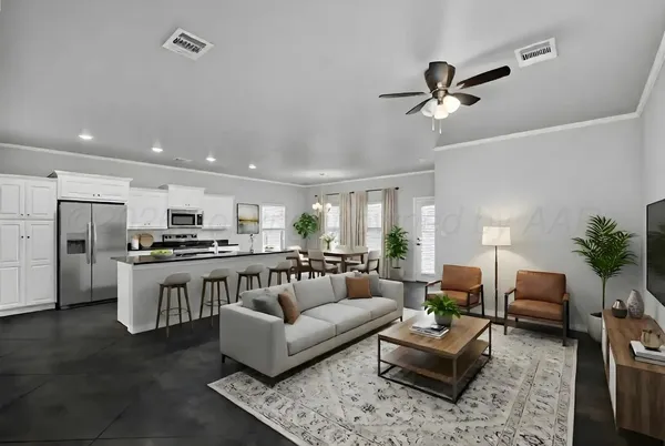 a living room with stainless steel appliances furniture and a view of kitchen