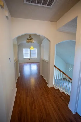 a view of entryway with wooden floor
