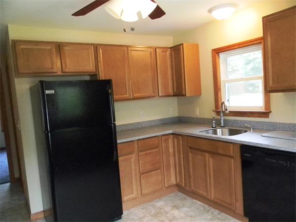 228 Gage Road Athol, MA 01331 - Photo 7 of 23 a kitchen with a sink a refrigerator and cabinets