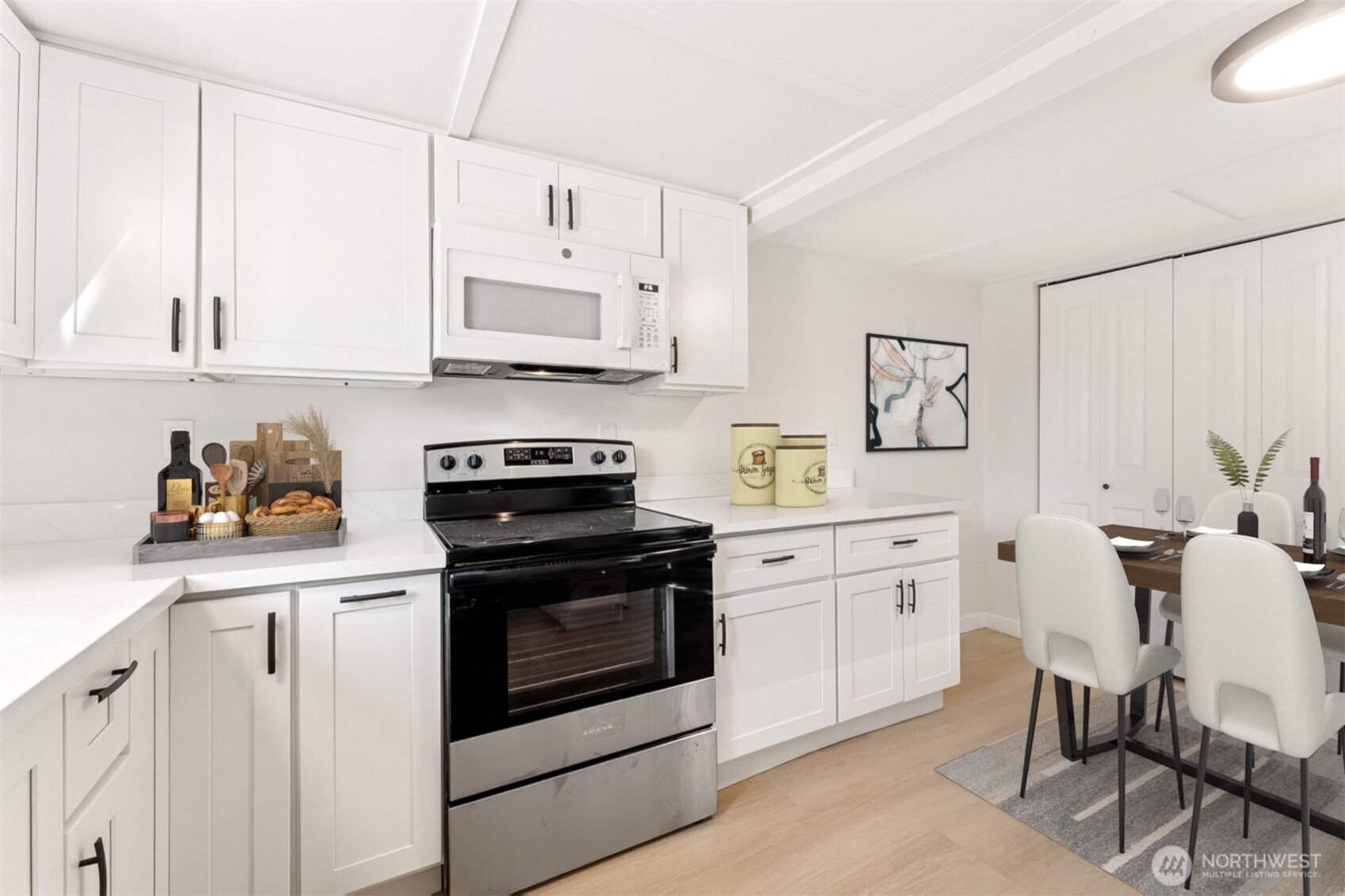 1616 11th Street Bremerton, WA 98337 - Photo 11 of 33 a kitchen with white cabinets and white appliances