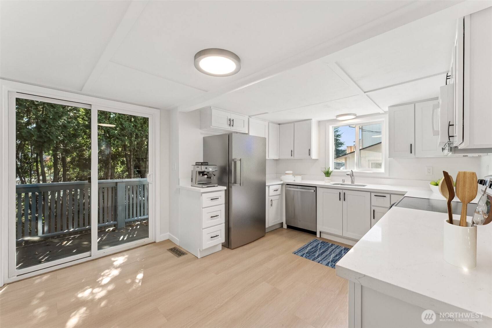 1616 11th Street Bremerton, WA 98337 - Photo 14 of 33 a kitchen with a refrigerator sink stove and cabinets