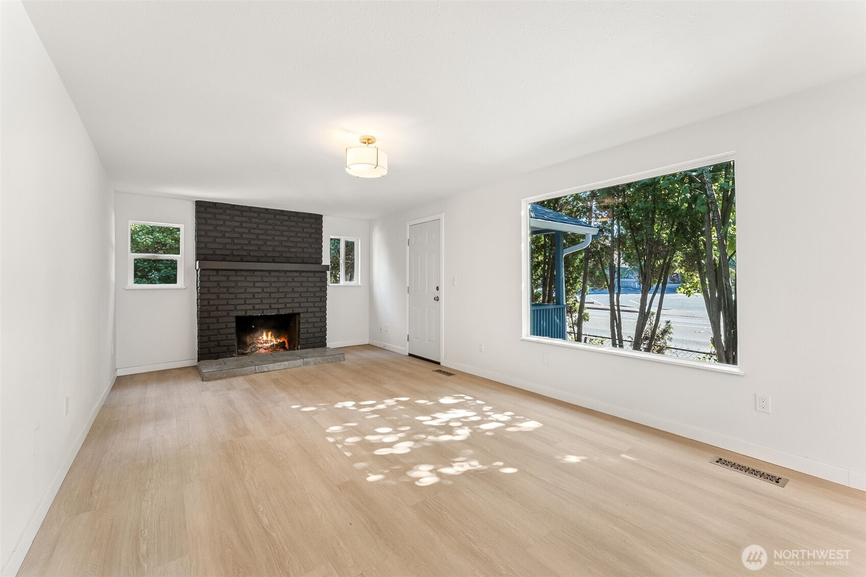 1616 11th Street Bremerton, WA 98337 - Photo 7 of 33 an empty room with windows and fireplace