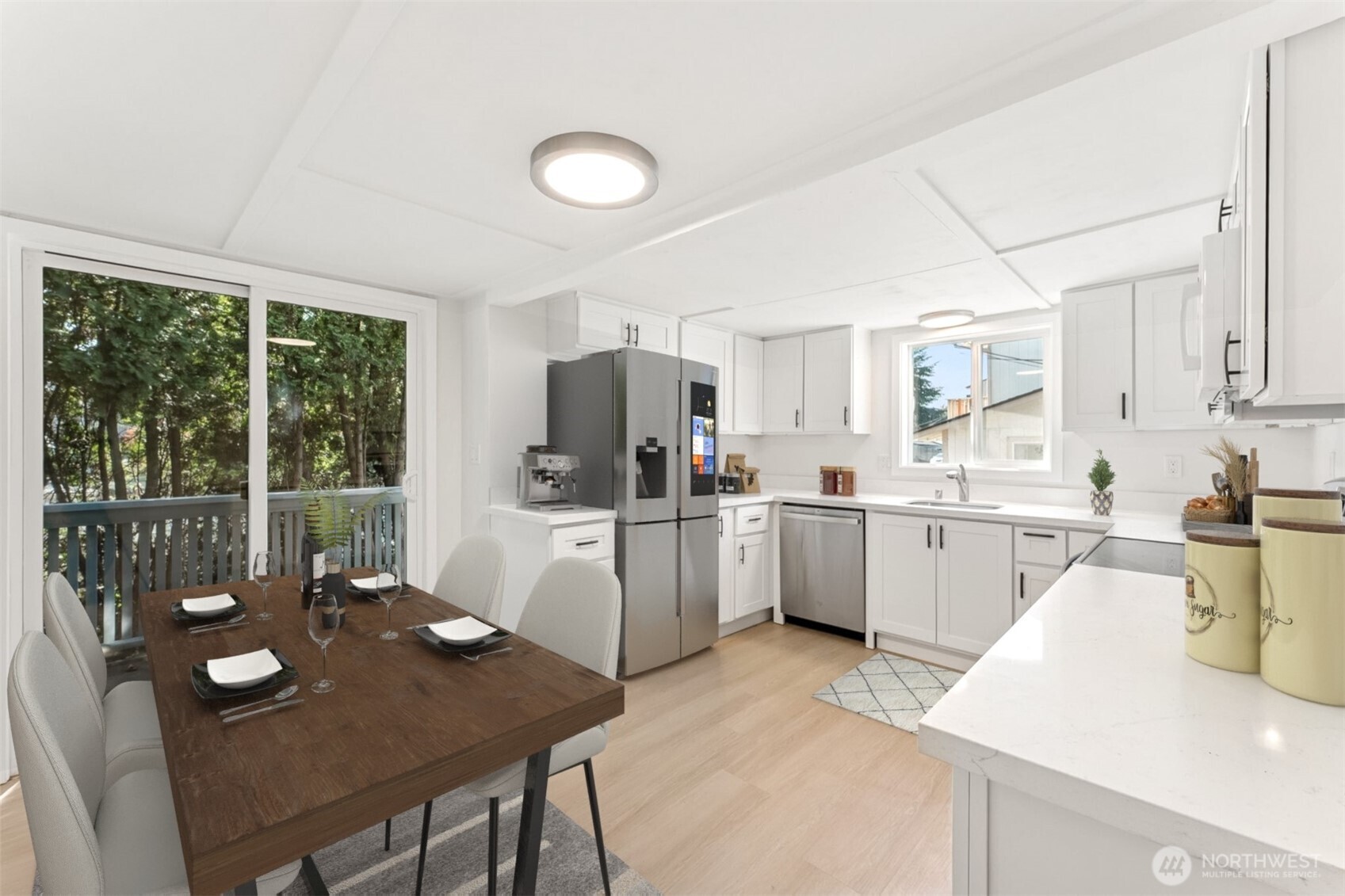 1616 11th Street Bremerton, WA 98337 - Photo 10 of 33 a open kitchen with white cabinets and stainless steel appliances