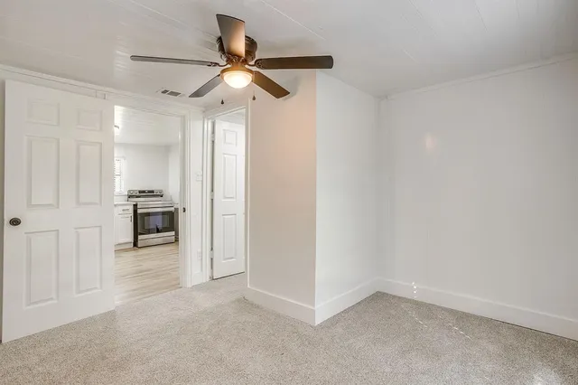 wooden floor in an empty room and a window