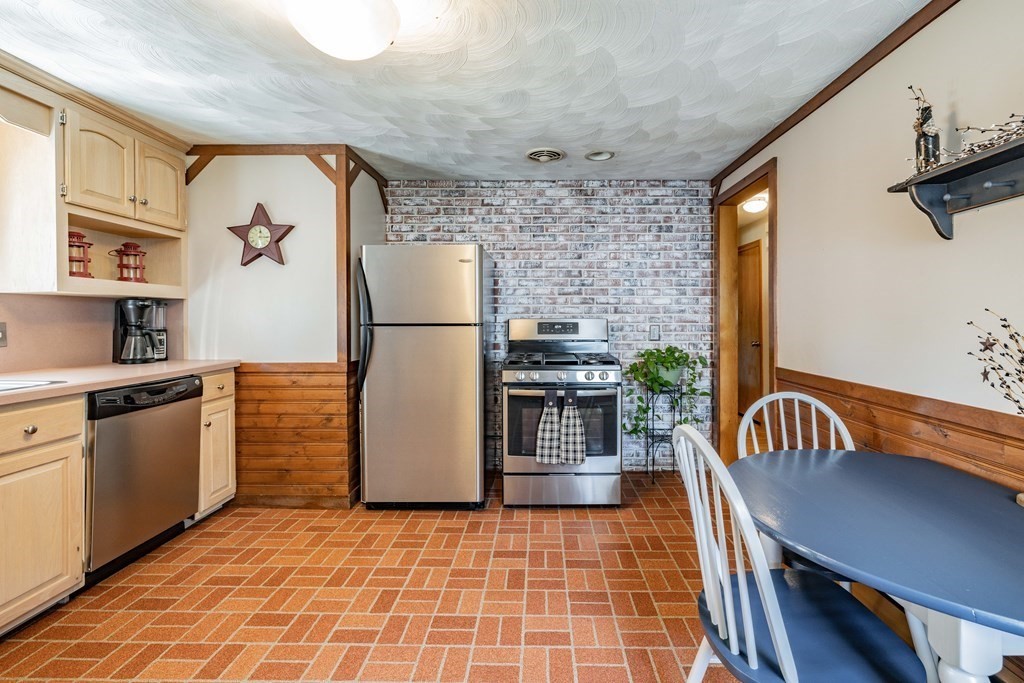90 Brittany Road Springfield, MA 01151 - Photo 3 of 38 a kitchen with a refrigerator and a sink