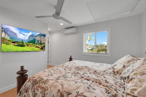 a living room with furniture gym equipment and a window
