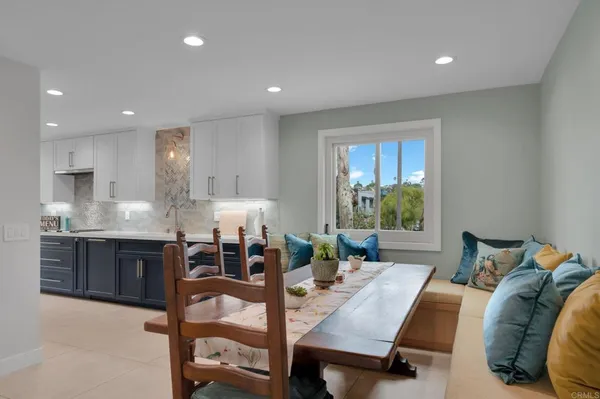 a kitchen with stainless steel appliances a stove a sink and a microwave