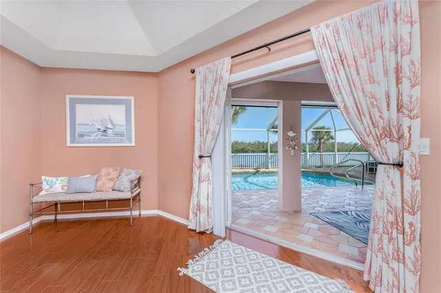 an aerial view of residential houses with outdoor space and swimming pool