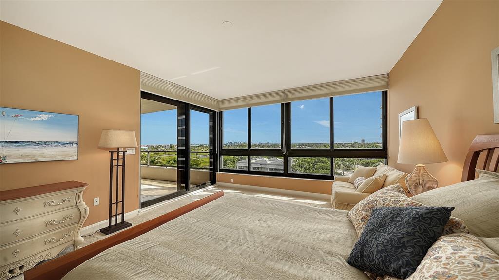 545 Sanctuary Drive, Unit B506 Longboat Key, FL 34228 - Photo 14 of 53 a spacious bedroom with a big bed and a large window