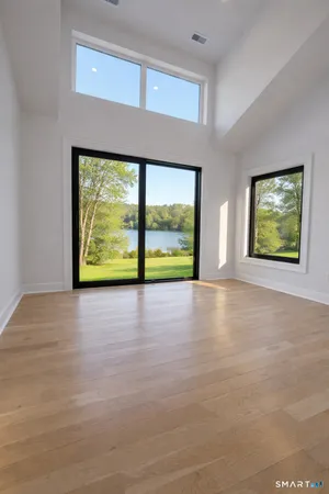 a view of an empty room with a window