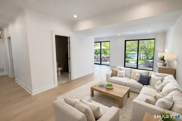 a living room with furniture and a large window
